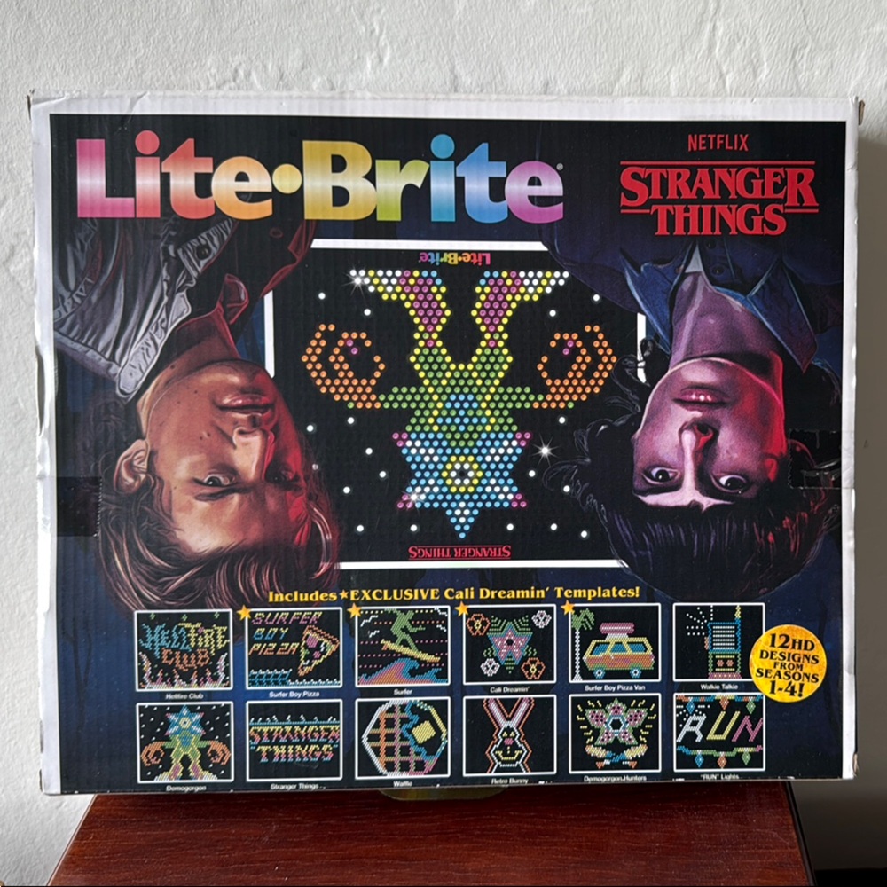 Black Puzzle Game with Colorful Light Pegs